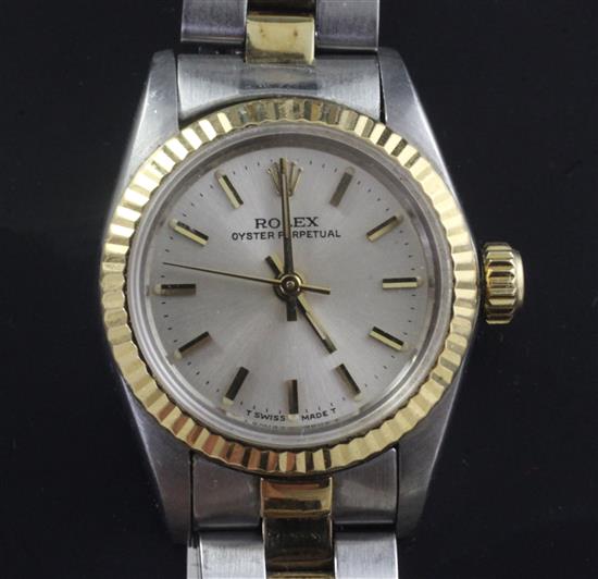 A ladys 1980s gold and steel Rolex Oyster Perpetual wrist watch,